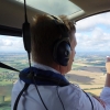 Instructor pointing in R44 cockpit