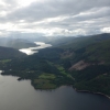 View of lakes and mountains from R44 cockpit