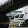 Tim Gilbert Instructor checking fuel R44
