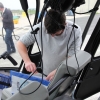 Commercial Helicopter Pilot Paperwork in Cockpit during refuel in France