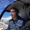 Tim Gilbert in R22 in mountains